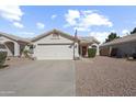 Charming single-story home with a two-car garage, desert landscaping, and American flag displayed at 8226 W Eugie Ave, Peoria, AZ 85381