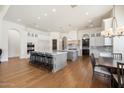 Spacious white kitchen with double islands, high-end appliances, and ample counter space at 10050 N 58Th St, Paradise Valley, AZ 85253