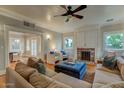 Cozy living room with fireplace, plush seating, and large windows, perfect for relaxation at 102 W Almeria Rd, Phoenix, AZ 85003