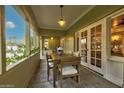 Covered outdoor dining area with a table and chairs, offering a serene space for meals at 102 W Almeria Rd, Phoenix, AZ 85003