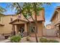 Charming two-story home with covered porch and desert landscaping at 1059 S Cheshire Ln, Gilbert, AZ 85296
