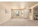 Spacious living room with ample natural light, neutral decor and seamless flow at 12508 W Highland Ave, Litchfield Park, AZ 85340