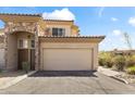 Charming home featuring a stone facade, two-car garage, and desert landscaping at 13700 N Fountain Hills Blvd # 365, Fountain Hills, AZ 85268