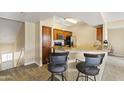 Kitchenette features granite countertops, stainless steel appliances, breakfast bar, and bar seating at 13700 N Fountain Hills Blvd # 365, Fountain Hills, AZ 85268