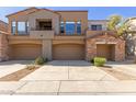 Charming townhouse featuring multiple car garages and lovely architecture at 19550 N Grayhawk Dr # 1044, Scottsdale, AZ 85255