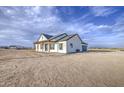 Expansive view of the house showcasing its architecture on a large lot with a beautiful sky at 28003 N Faded Creek Dr, Florence, AZ 85132