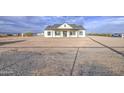 Attractive single-story home with a inviting porch and neat landscaping in a scenic neighborhood at 28003 N Faded Creek Dr, Florence, AZ 85132