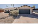 Charming home with low maintenance desert landscaping and a two-car garage at 3015 E Dahlia Dr, Phoenix, AZ 85032