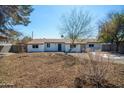 Charming single-story home with low maintenance desert landscaping in the front yard at 3249 E Sunnyside Ln, Phoenix, AZ 85032