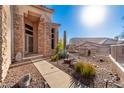 Desert xeriscape landscaping and stone accents at 8219 E Tesoro Cir, Mesa, AZ 85207