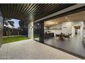 Spacious living space flows to the backyard featuring a modern kitchen and an open floor plan at 8409 E Clarendon Ave, Scottsdale, AZ 85251