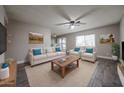 Bright living room with neutral walls, ceiling fan, contemporary furniture and decor at 10411 N 11Th Ave # 28, Phoenix, AZ 85021