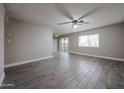 Spacious living room with tile floors and ample natural light from the large window at 10411 N 11Th Ave # 28, Phoenix, AZ 85021