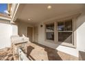 Inviting front porch with stone pillars and a paved walkway leading to the front door at 10656 E Plata Ave, Mesa, AZ 85212