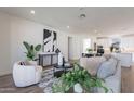 Bright living room features contemporary decor, a plush sofa, modern art and an inviting atmosphere at 11300 N Casa Dega Dr # 1058, Surprise, AZ 85388