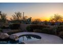 Relaxing spa surrounded by desert vegetation at sunset at 12083 E Wethersfield Dr, Scottsdale, AZ 85259