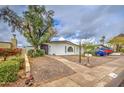 Inviting single-story home featuring a well-maintained xeriscaped front yard at 1340 E Townley Ave, Phoenix, AZ 85020