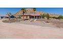 Charming single-story home with desert landscaping and steps leading to the front entrance at 1440 W Christie Lyn Ln, San Tan Valley, AZ 85144