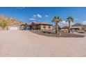 Spacious home with a covered parking area and desert landscaping at 1440 W Christie Lyn Ln, San Tan Valley, AZ 85144