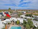 Community aerial view showcasing a pool, mature landscaping, and convenient access to nearby amenities at 16807 E Gunsight Dr # B18, Fountain Hills, AZ 85268