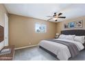 Comfortable bedroom featuring a neutral color scheme, a plush bed, and a window offering natural light at 17056 E Calle Del Oro Dr # B, Fountain Hills, AZ 85268