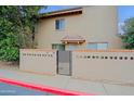 Charming townhouse exterior with gated front patio and desert landscaping for added privacy and curb appeal at 17056 E Calle Del Oro Dr # B, Fountain Hills, AZ 85268