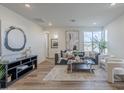 Cozy living room filled with natural light, stylish decor, and comfortable seating arrangements at 2121 W Sonoran Desert Dr # 93, Phoenix, AZ 85085