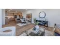 Open-concept living space with kitchen view, dining area, and modern decor elements at 2121 W Sonoran Desert Dr # 93, Phoenix, AZ 85085