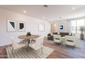 Elegant living room featuring modern decor, stylish furnishings, and natural light from a large window at 2121 W Sonoran Desert Dr # 93, Phoenix, AZ 85085