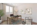 Bright home office with large window, modern desk, and comfortable seating, perfect for productivity at 2121 W Sonoran Desert Dr # 93, Phoenix, AZ 85085
