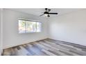 Bright bedroom with laminate wood flooring, and white walls at 2217 E Sheridan St, Phoenix, AZ 85006
