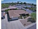 Aerial view showcasing the home's layout, landscaping, and location in a quiet neighborhood at 2605 E Geneva Dr, Tempe, AZ 85282