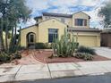 Two-story home with desert landscaping, a tile roof, and an attached two-car garage at 3325 E Grand Canyon Dr, Chandler, AZ 85249