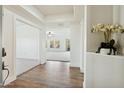 Bright entryway featuring wood floors, white walls, an open floorplan and decorative accents at 33575 N Dove Lakes Dr # 2028, Cave Creek, AZ 85331