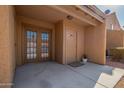 Welcoming entrance features a private front patio with double doors and a security door leading inside at 3511 E Baseline Rd # 1076, Phoenix, AZ 85042