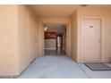 Open entryway showcases the kitchen with stainless steel appliances and neutral colors creating a seamless transition at 3511 E Baseline Rd # 1076, Phoenix, AZ 85042