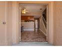 Inviting entryway shows stairs leading upstairs to bedrooms and an open view of the living room at 3511 E Baseline Rd # 1076, Phoenix, AZ 85042