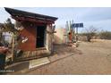 A small outbuilding with a solar panel and additional storage or utility space at 37448 N 301St Ave, Wittmann, AZ 85361