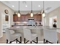 A kitchen featuring pendant lighting, stainless steel appliances, and a granite island at 3931 N 163Rd Dr, Goodyear, AZ 85395