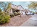 Inviting two-story home with manicured landscaping and a welcoming front porch at 4032 W Lydia Ln, Phoenix, AZ 85041