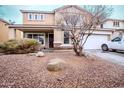 Attractive home with desert landscaping, covered porch, and a two car garage at 4032 W Lydia Ln, Phoenix, AZ 85041