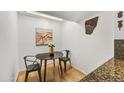 Cozy dining area with skylight, table for two, and stylish decor at 6310 E Avalon Dr, Scottsdale, AZ 85251