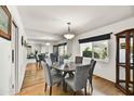 Elegant dining room featuring round table, six chairs, and large mirror at 6310 E Avalon Dr, Scottsdale, AZ 85251