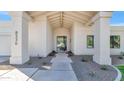 Home entrance with a wide walkway, gravel landscaping and modern design at 8336 N 72Nd Pl, Scottsdale, AZ 85258