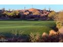 Expansive golf course view with manicured green and natural desert landscaping at 10222 E Southwind Ln # 1054, Scottsdale, AZ 85262