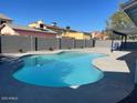 Backyard pool in a fenced-in yard with a covered patio area at 1120 W Barrow Dr, Chandler, AZ 85224