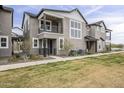 Attractive exterior of a two-story townhome with balcony and modern architectural details at 11300 N Casa Dega Dr # 1020, Surprise, AZ 85388