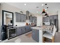 Well-appointed kitchen with gray cabinetry, stainless steel appliances, and granite countertops at 12047 E Sereno Rd, Gold Canyon, AZ 85118