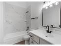 Updated bathroom features a marble tiled shower and black hardware at 1455 N Alma School Rd # 38, Mesa, AZ 85201