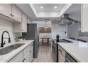 Bright kitchen with stainless steel appliances, a deep sink, and a view of the dining nook at 1455 N Alma School Rd # 38, Mesa, AZ 85201